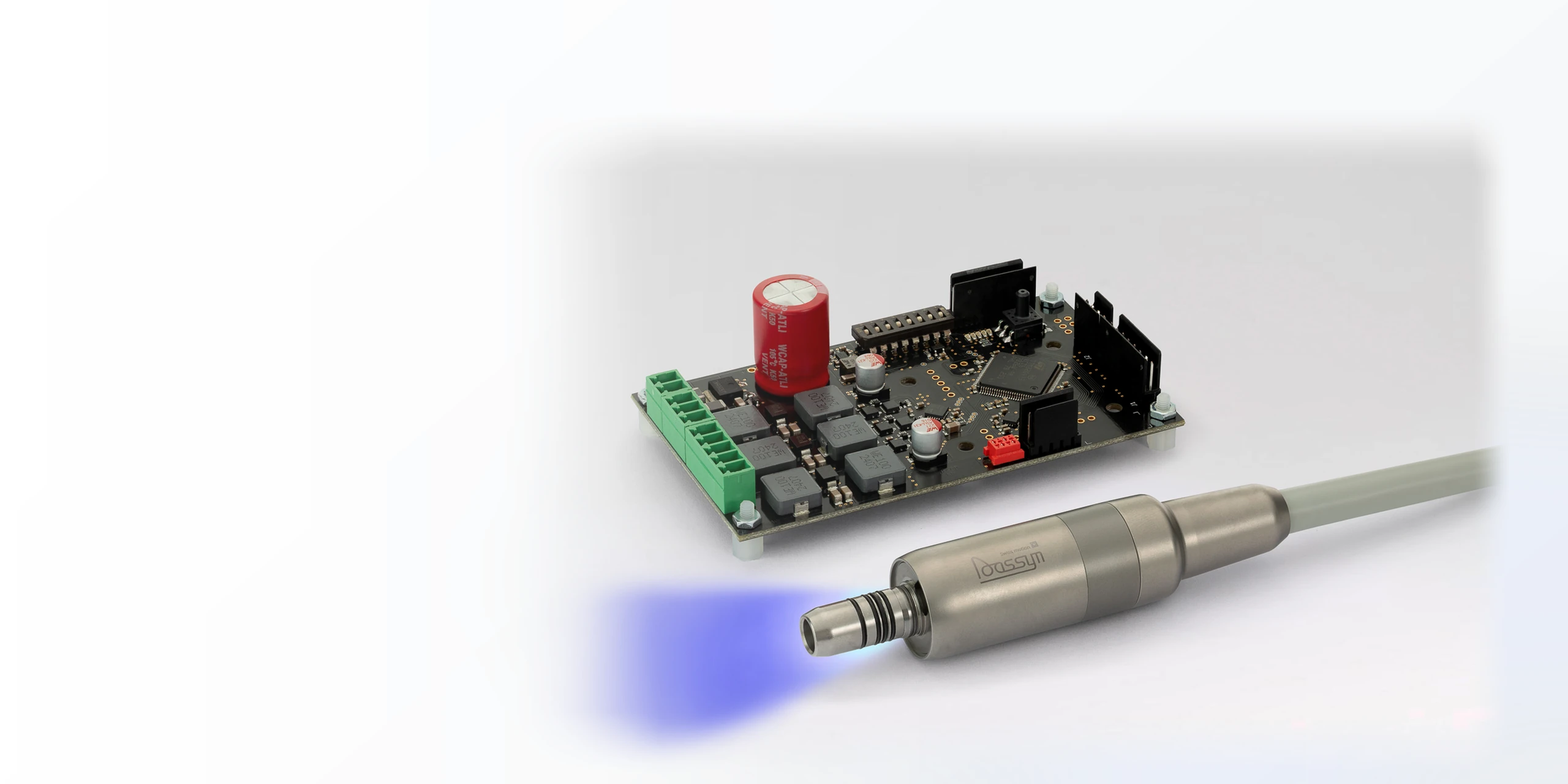 Dassym dental micromotors and circuit boards showcasing Swiss-made precision dental equipment